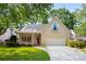 Charming single-Gathering home with a well-manicured lawn, two-car garage, and inviting front porch at 4481 Mccart Cv, Stone Mountain, GA 30083
