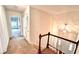 Hallway with carpeted floors and views of the bedrooms at 4481 Mccart Cv, Stone Mountain, GA 30083
