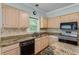 Kitchen features granite countertops, stainless steel appliances, and wooden cabinets at 4481 Mccart Cv, Stone Mountain, GA 30083