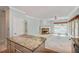Bright living room with large windows and traditional fireplace and direct view of the kitchen at 4481 Mccart Cv, Stone Mountain, GA 30083