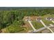 Wide aerial view of property showcasing home, long driveway, and surrounding lush greenery at 47 Whitley Ct, Dallas, GA 30157