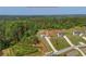 Aerial view of a beautiful home and its expansive lot surrounded by lush trees and greenery at 47 Whitley Ct, Dallas, GA 30157