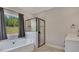 Modern bathroom with a large shower, and a garden tub at 47 Whitley Ct, Dallas, GA 30157