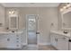 Elegant bathroom featuring double sinks and vanities with modern fixtures at 47 Whitley Ct, Dallas, GA 30157
