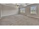 Spacious carpeted bedroom featuring a coffered ceiling and large windows at 47 Whitley Ct, Dallas, GA 30157