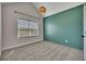 A bright bedroom featuring carpet floors, a window with blinds and an accent wall at 47 Whitley Ct, Dallas, GA 30157
