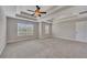 Spacious carpeted bedroom featuring a coffered ceiling and large windows at 47 Whitley Ct, Dallas, GA 30157