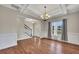 Spacious dining room with hardwood floors, coffered ceiling, and a view of the entryway at 47 Whitley Ct, Dallas, GA 30157