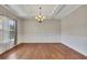 Elegant dining room with hardwood floors, decorative molding, and a modern chandelier at 47 Whitley Ct, Dallas, GA 30157