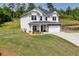 Beautiful two-story home with a well-kept lawn, fenced property line, and an attached two-car garage at 47 Whitley Ct, Dallas, GA 30157