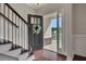 Warm foyer with hardwood floors, stairs, and a view of the exterior through the front door at 47 Whitley Ct, Dallas, GA 30157