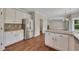 Kitchen with granite counters, stainless steel appliances, white cabinets, and hardwood floors at 47 Whitley Ct, Dallas, GA 30157