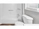 Well-lit bathroom features a combined tub and shower and a toilet for convenience at 563 Navarre Dr, Stone Mountain, GA 30087