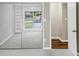 Bright bedroom featuring mirrored closet doors and a window providing natural light at 563 Navarre Dr, Stone Mountain, GA 30087