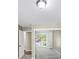 Bedroom featuring mirrored closet doors and an open door to a room with hardwood floors at 563 Navarre Dr, Stone Mountain, GA 30087