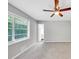 Bright bedroom with a ceiling fan and a window for fresh air and natural light at 563 Navarre Dr, Stone Mountain, GA 30087