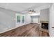 This is a view of the living room with sliding glass doors, a fireplace, and built in shelving at 563 Navarre Dr, Stone Mountain, GA 30087