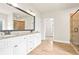 Elegant bathroom with double vanity, granite countertop, tiled floors and walk-in shower creates a spa-like experience at 100 Nemoura Ct, Fairburn, GA 30213