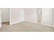 Spacious bedroom with neutral walls, carpeted floors, a closet, and white trim throughout at 100 Nemoura Ct, Fairburn, GA 30213