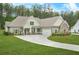 Inviting single-Gathering home with attached garage, stone accents, and beautiful landscaping at 100 Nemoura Ct, Fairburn, GA 30213