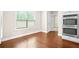 Bright kitchen with stainless double oven, hardwood floors, and a large window offering natural light at 100 Nemoura Ct, Fairburn, GA 30213