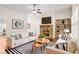 Cozy living room with fireplace, modern furniture, and stylish decor creating an inviting atmosphere at 100 Nemoura Ct, Fairburn, GA 30213