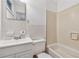 Full bathroom featuring a vanity, toilet, and tiled shower/tub combination at 2015 Twelve Oaks Nw Cir, Kennesaw, GA 30144
