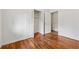 Bedroom view showcasing hardwood floors, a closet, and access to another room at 2015 Twelve Oaks Nw Cir, Kennesaw, GA 30144