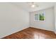 Bright bedroom with hardwood floors, a ceiling fan, and a window with natural light at 2015 Twelve Oaks Nw Cir, Kennesaw, GA 30144