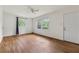 This bedroom is illuminated by lots of natural light and features hardwood floors and a ceiling fan at 2015 Twelve Oaks Nw Cir, Kennesaw, GA 30144