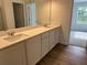 Dual-sink bathroom vanity with modern finishes is the perfect place to start the day at 2105 Boxwood Se Cir, Conyers, GA 30094