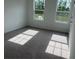 Bright bedroom with large windows, neutral walls, and plush carpeting offers a serene space at 2105 Boxwood Se Cir, Conyers, GA 30094