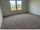 Comfortable bedroom features natural light and soft carpeting for a relaxing environment at 2105 Boxwood Se Cir, Conyers, GA 30094