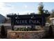 Elegant Alder Park community entrance sign amidst landscaping and brickwork at 2105 Boxwood Se Cir, Conyers, GA 30094
