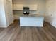 Modern kitchen features an island and sleek stainless steel appliances at 2105 Boxwood Se Cir, Conyers, GA 30094