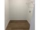 Convenient laundry room with wood-style floors and utility connections at 2105 Boxwood Se Cir, Conyers, GA 30094