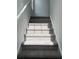 Carpeted stairway leading to the upper level of the home at 2105 Boxwood Se Cir, Conyers, GA 30094