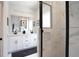 Beautiful bathroom featuring double vanity, modern fixtures, and a glass-enclosed shower at 4960 Villager Ln, Stone Mountain, GA 30083