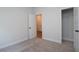 Bright bedroom featuring plush carpeting, multiple closets, and ensuite access at 4960 Villager Ln, Stone Mountain, GA 30083