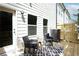 Cozy outdoor deck featuring modern chairs and convenient access to the home at 4960 Villager Ln, Stone Mountain, GA 30083