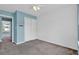 Comfortable bedroom featuring light blue walls, closet, and a view of the home's exterior at 7293 Bridlewood Ct, Jonesboro, GA 30236