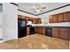 Functional kitchen featuring wooden cabinets and black appliances at 7293 Bridlewood Ct, Jonesboro, GA 30236
