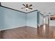 Open concept living room with beautiful hardwood flooring and a ceiling fan at 7293 Bridlewood Ct, Jonesboro, GA 30236