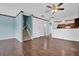 Inviting living room featuring hardwood floors, neutral paint, and an open floor plan at 7293 Bridlewood Ct, Jonesboro, GA 30236