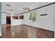 Bright living room with hardwood floors and a view of the kitchen at 7293 Bridlewood Ct, Jonesboro, GA 30236
