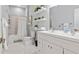 Bright bathroom with a double vanity, modern fixtures, and a tiled shower at 991 Metropolitan Sw Pkwy, Atlanta, GA 30310