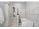 Sleek bathroom showcasing a glass-enclosed shower with modern fixtures and a soaking tub at 991 Metropolitan Sw Pkwy, Atlanta, GA 30310