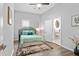 Cozy bedroom features a comfortable bed, and an ensuite bathroom at 991 Metropolitan Sw Pkwy, Atlanta, GA 30310