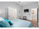 Serene bedroom with ensuite bathroom, flat screen TV and stylish furnishings at 991 Metropolitan Sw Pkwy, Atlanta, GA 30310