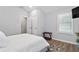 Well-lit bedroom featuring a large window and minimalist decor at 991 Metropolitan Sw Pkwy, Atlanta, GA 30310